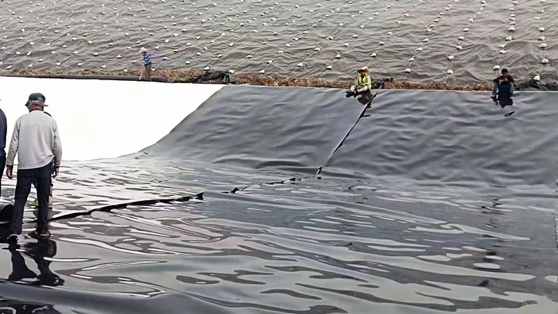 Welded seams of 2mm HDPE geomembrane in landfill bottom lining ensuring zero leakage
